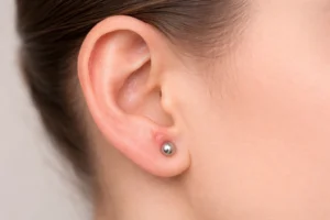 Small irritation bump on ear piercing showing early inflammation
